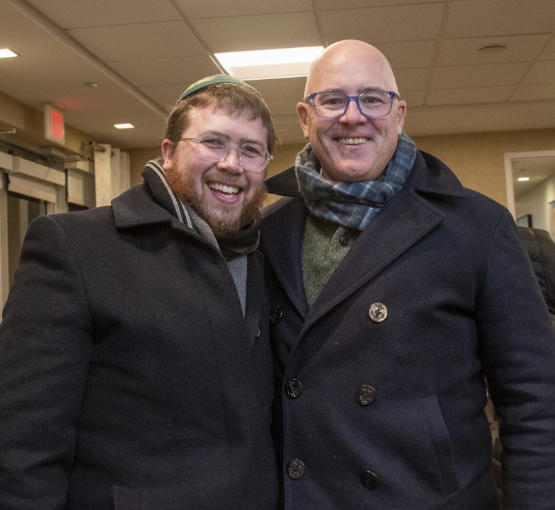 Rabbi Sholom Vogel, left, talks with Sen. Russ Huxtable, D-Lewes, during the menorah lighting celebration.